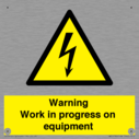 warning-work-in-progress-on-equipmentwith-electrical-hazard-symbol~